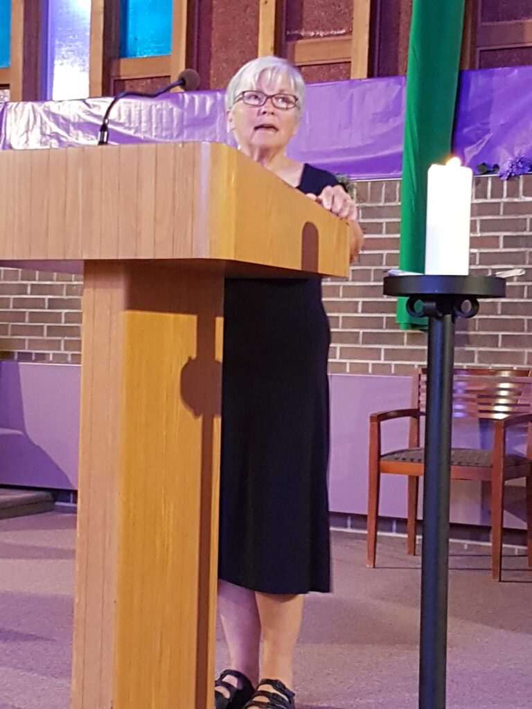 Woman standing at a lectern