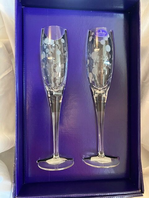set of 2 Royal Doulton crystal champagne flutes in an open blue box