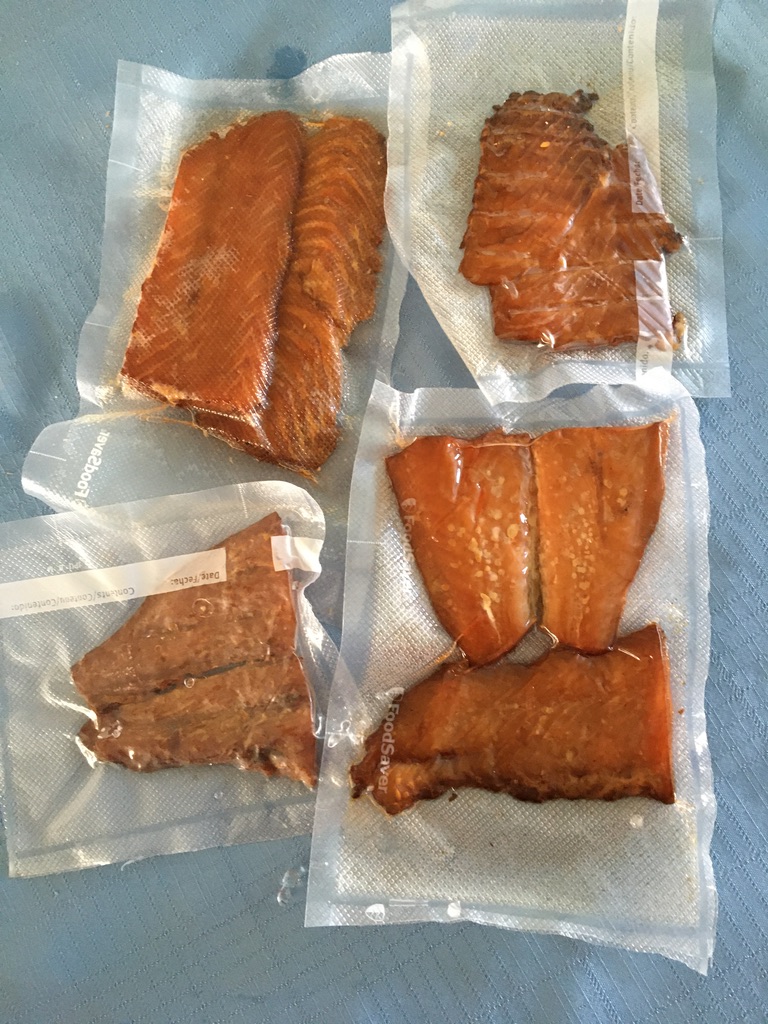vacuum-packed plastic pouches of smoked salmon